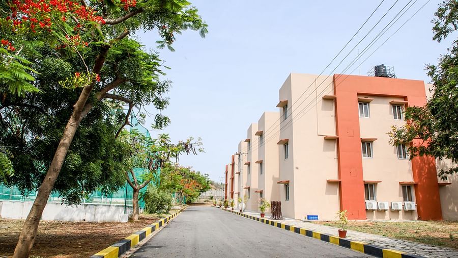 A different angle of aA different angle of a hotel facade, showcasing the clean lines of the building and the landscaped street at Greens Inn - Comfortable Stay in Hyderabad. hotel facade, showcasing the clean lines of the building and the landscaped stree
