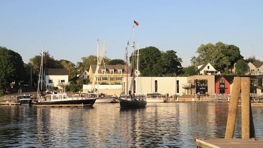 Picturesque harbour view with moored boats and waterfront buildings near Hartstone Inn