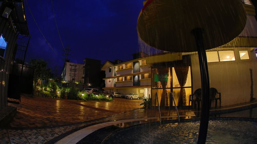Facade of Highland Resort as seen at night, from beside the swimming pool.