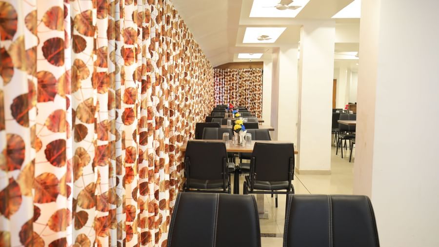 A row of dining tables neatly arranged at the Darbar Restaurant in Highland Restaurant.