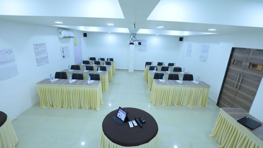 Classroom seating arrangement, projector, air-conditioning in the spacious Olive banquet hall, with ample lighting, at Highland Resort.