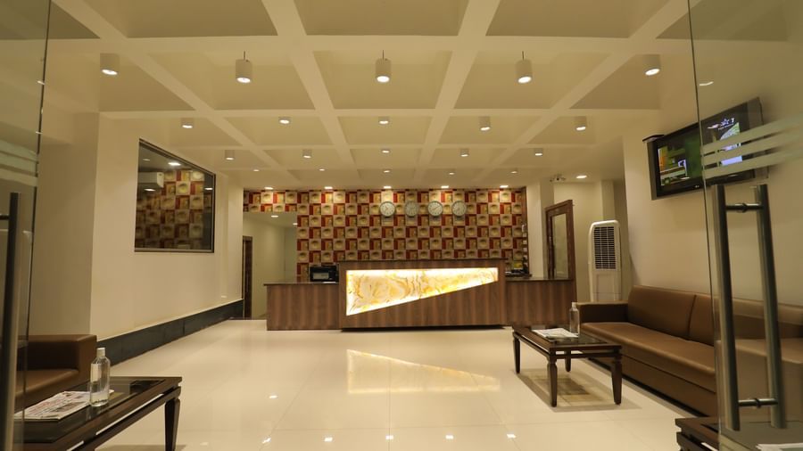 The grand lobby area of Highland Resort featuring a reception desk, and ample lighting.