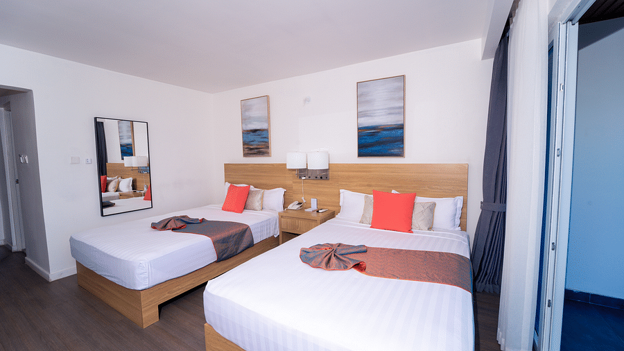 An image of a Montego Bay hotel room with double beds and a balcony - Hotel 39, Jamaica (Montego Bay)