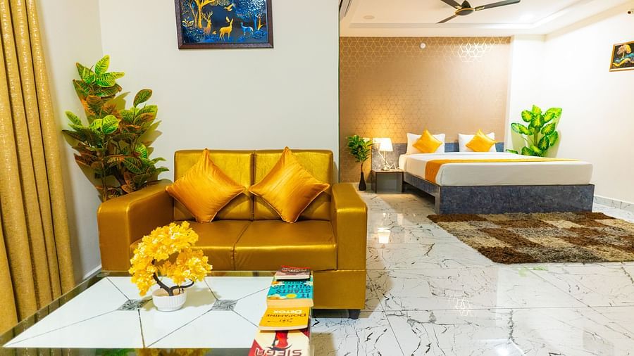 An image of a Suite with sitting area, a king size, AC, fan, etc. Hotel Aerotel, Hyderabad - A Unit of Comfort Hometel