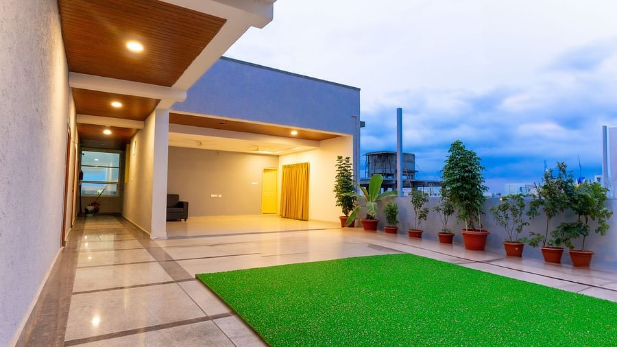 An image of a lawn area in a well lit building - Hotel Aerotel, Hyderabad - A Unit of Comfort Hometel
