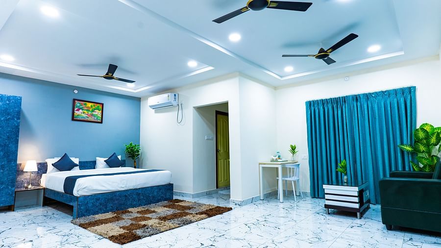 An image of a Suite with sitting area, a king size, AC, fan, etc. Hotel Aerotel, Hyderabad - A Unit of Comfort Hometel