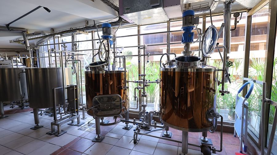 Image of  a brewery setup of Hotel Amar with huge gold containers
