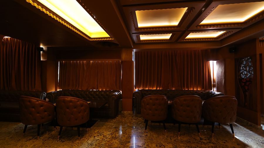 Image of seating arrangement of JBs lounge with chairs and tables