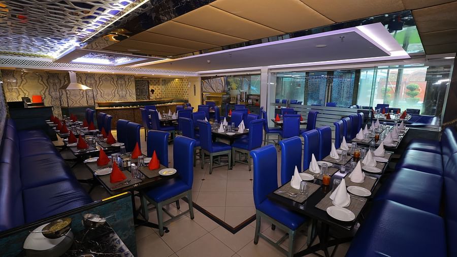 Image of Noor Jahan buffet restaurant with seating arrangement chairs and tables