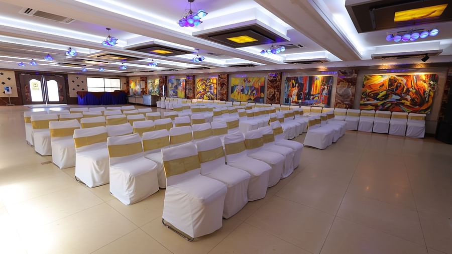 side view of Amar Convention Centre hall in Hotel Amar with classroom seating arrangement of chairs