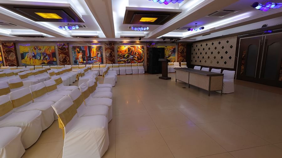 Close up image of Amar Convention Centre hall in Hotel Amar with classroom seating arrangement of chairs