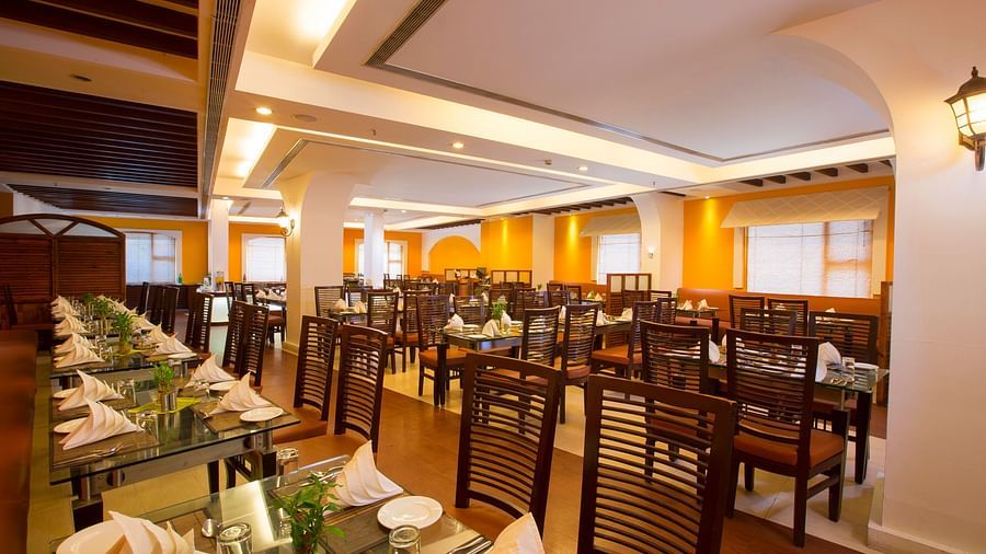 Le Boulevard featuring a dining table at Hotel Atithi - TGI Grand, Pondicherry