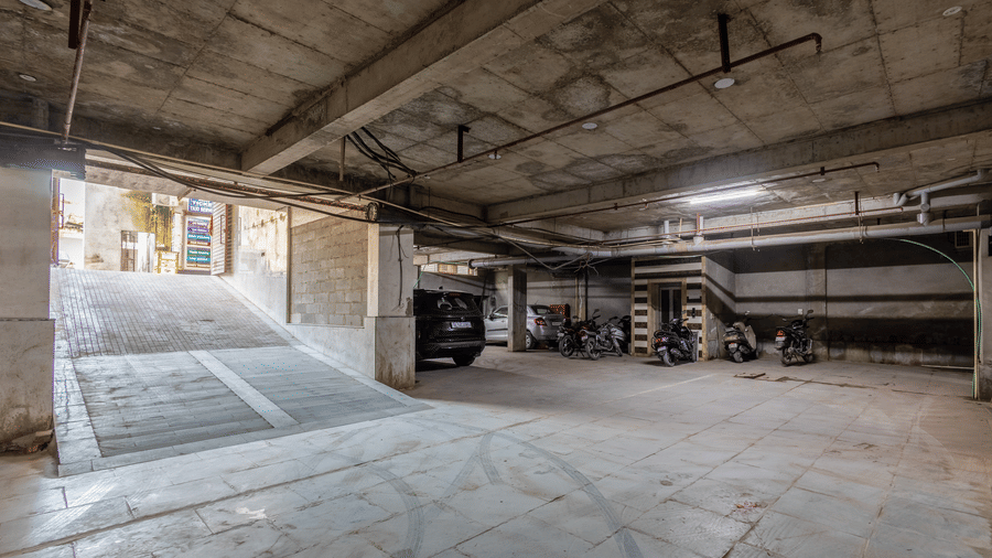 Parking space at Hotel Corporate Suites featuring a ramp for easy vehicle entry and exit