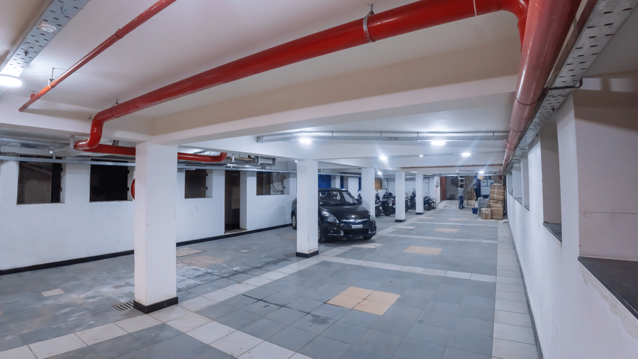 Empty underground parking garage at Hotel Grand Sabarees Madurai.
