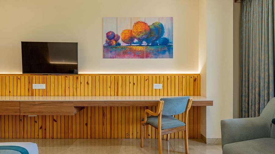 Work desk and entertainment unit in the executive king room in Hotel Highway King, Bagru.