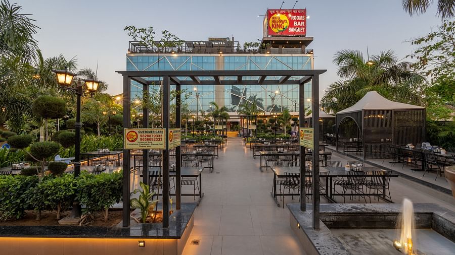 Entrance walkway with lantern-style lighting and the Hotel Highway King sign visible above the gate at Hotel Highway King, Jaipur.
