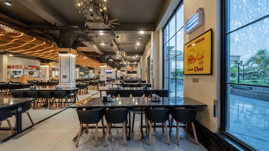 Dining hall at Hotel Highway King, Kishangarh, with its contemporary design and seating.
