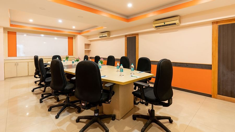 a rectangle seating arrangement inside the conference hall at Hotel Pai Vista, Mysore