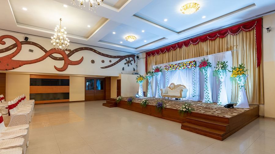 a decorated stage area during a wedding inside the banquet hall - Hotel Pai Vista, Mysore