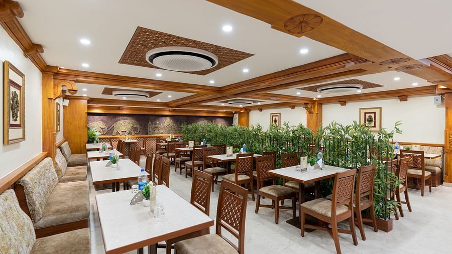 seating arrangements inside the restaurant area - Hotel Pai Vista, Mysore