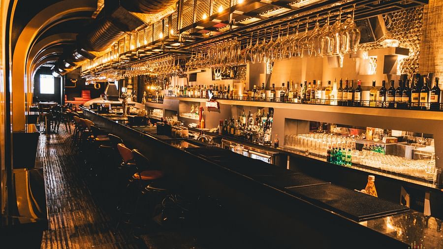 image of a bar counter with varieties of alcohol placed on display - Hotel Park Elanza, Chennai