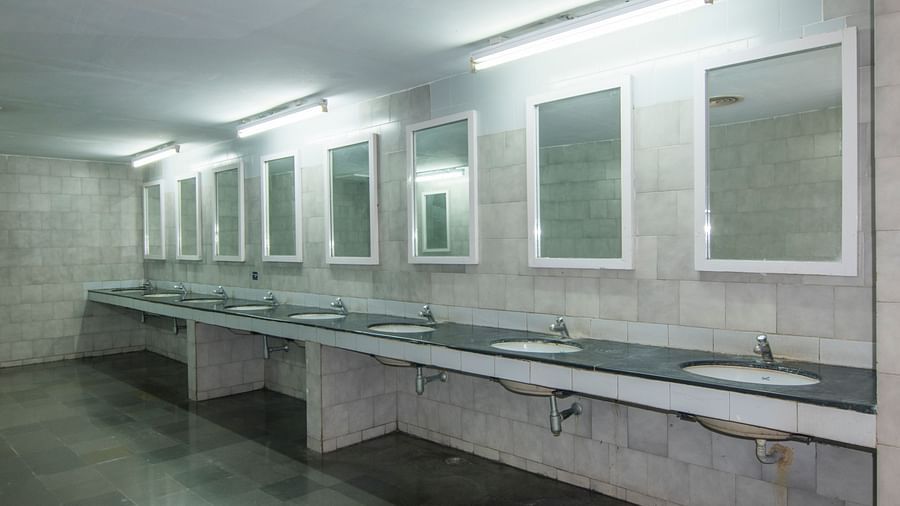 A shot of multiple mirrors hung on the wall in the washroom vanity area at Hotel Sahara - Modern Amenities in Ramoji Film City, Hyderabad.