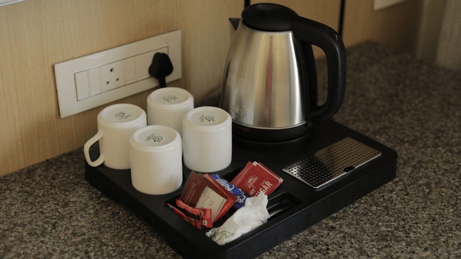 An electric kettle and amenity tray set in room at Hotel Seagull Digha