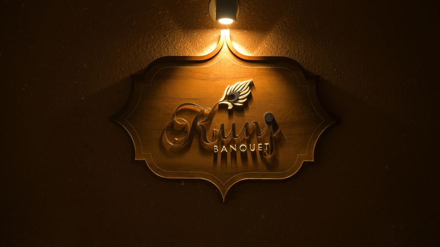 A plaque featuring the banquet hall’s emblem at Hotel Sonar Bangla, Mayapur.