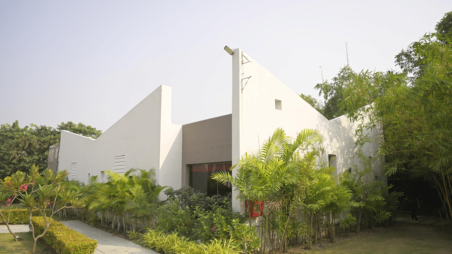 A spa building surrounded by greenery at Hotel Sonar Bangla, Mayapur.