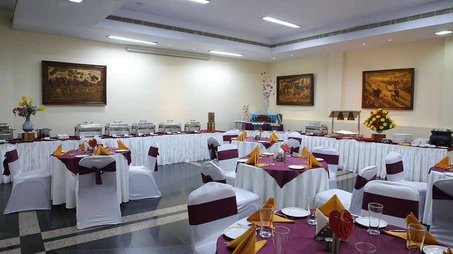 Lagan Hall decked with tables and chairs at Tara, Comfort Hotel in Hyderabad - Ramoji Film City.