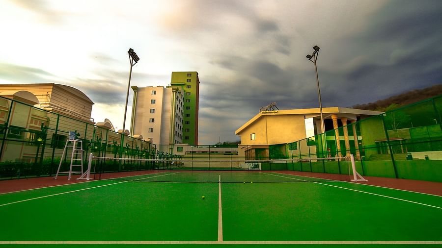 Tennis court with carpeted lawn at Tara, Comfort Hotel in Hyderabad - Ramoji Film City.