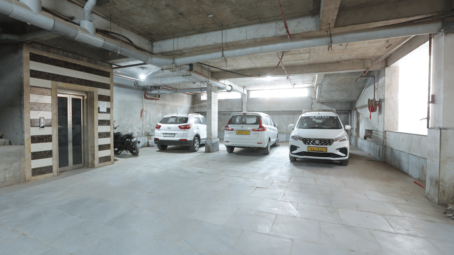 Spacious and secure underground parking facility with cars parked in designated spots - Hotel Velocity