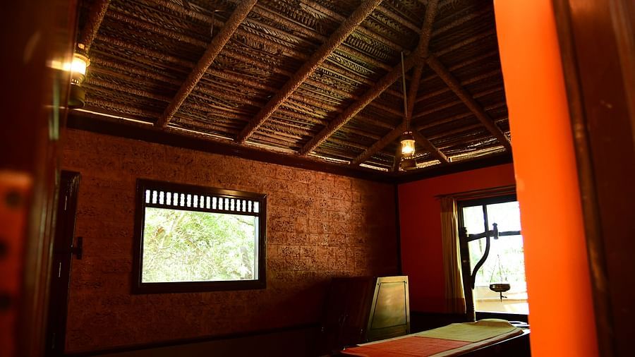 image of the ayurveda spa in hoysala village resort with two medium size windows in the room.