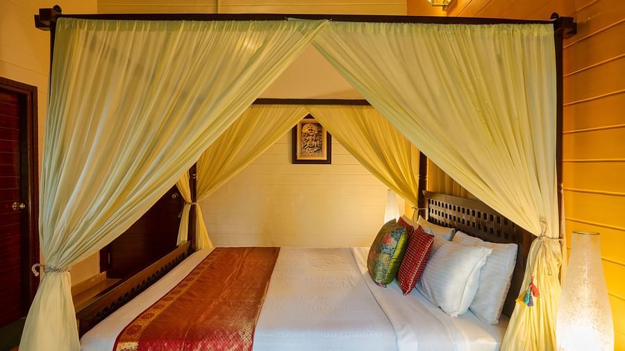 An image of a poster bed at Hoysala Village Resort, Hassan