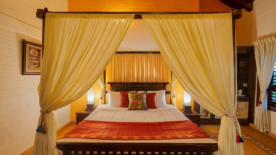 An image of a poster bed at Hoysala Village Resort, Hassan