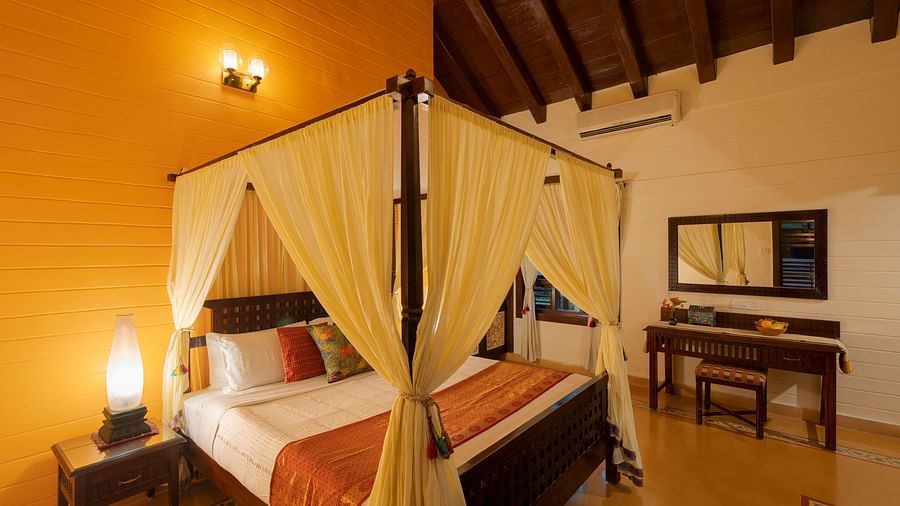 An image of a poster bed at Hoysala Village Resort, Hassan