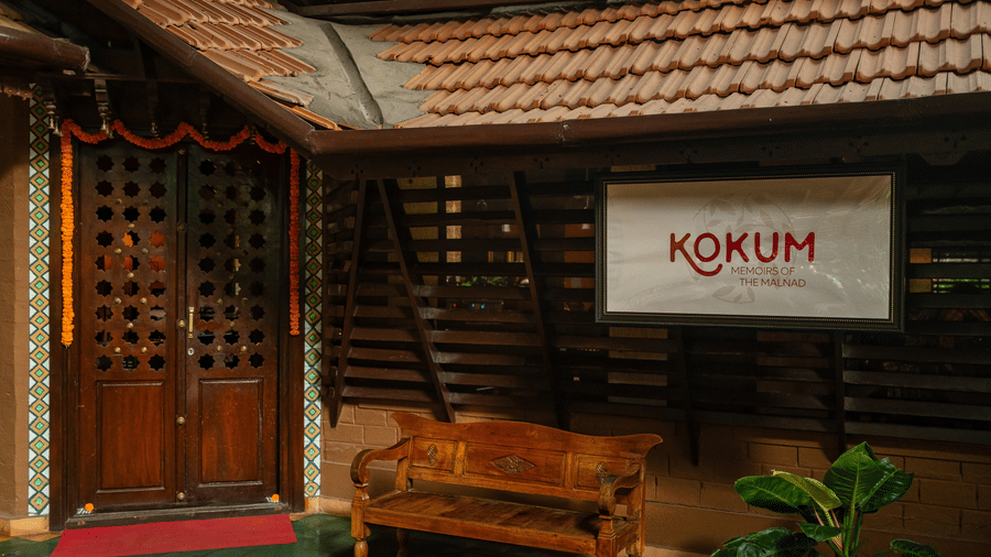 Facade view of the Kokam bar and restaurant at Hoysala Village Resort, Hassan, with a dewan below the signage.