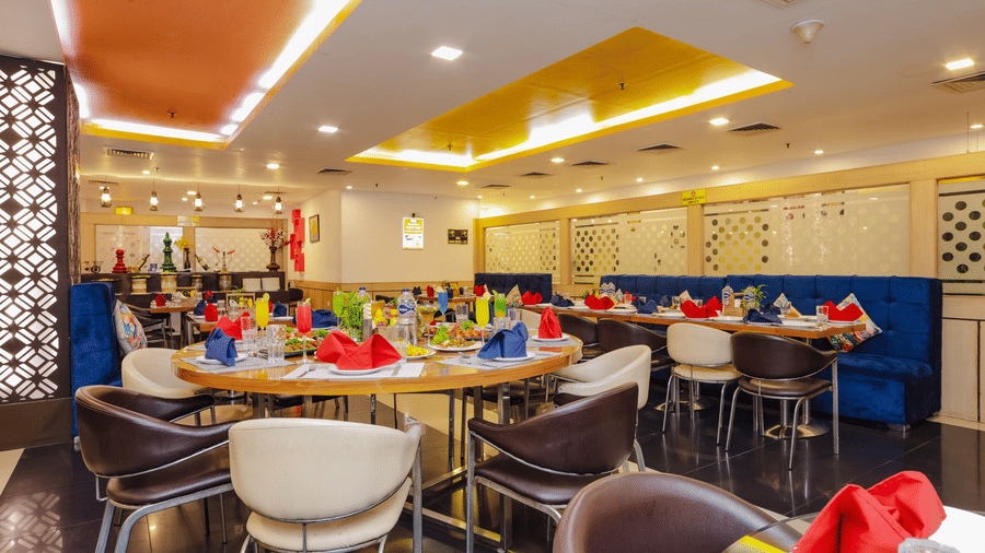 Another view of the restaurant showing its contemporary design and comfortable seating - Hyphen Grand, Haridwar