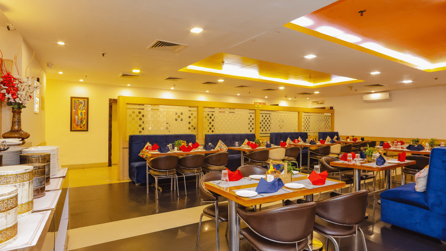 A wide shot of the restaurant interior, highlighting its spaciousness and inviting atmosphere - Hyphen Grand, Haridwar