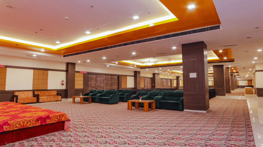 A large event space with seating areas and ample room for guests - Hyphen Grand, Haridwar