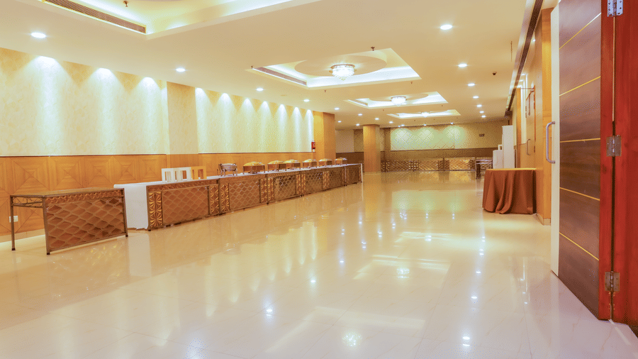 Buffet hallway with glossy flooring and ample lighting at Hyphen Premier Hotel, Meerut.