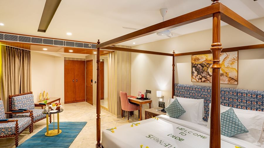 Spacious Suite with double bed, comfortable seating at Inde Signature Jaipur