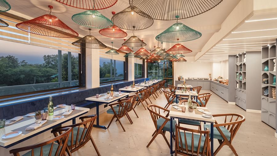Dining arrangement at Nutmegg - Infinitea Centric, Dharamshala