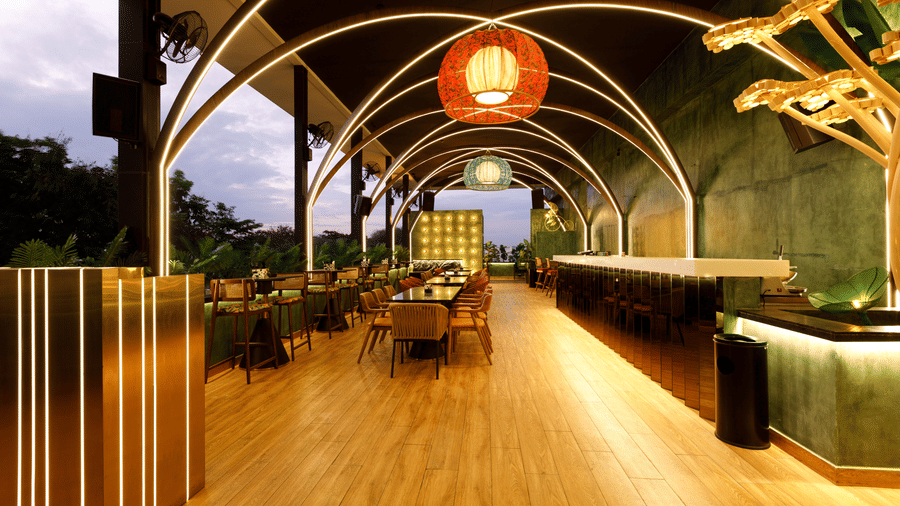 An image of a well lit restro bar with several chairs and table