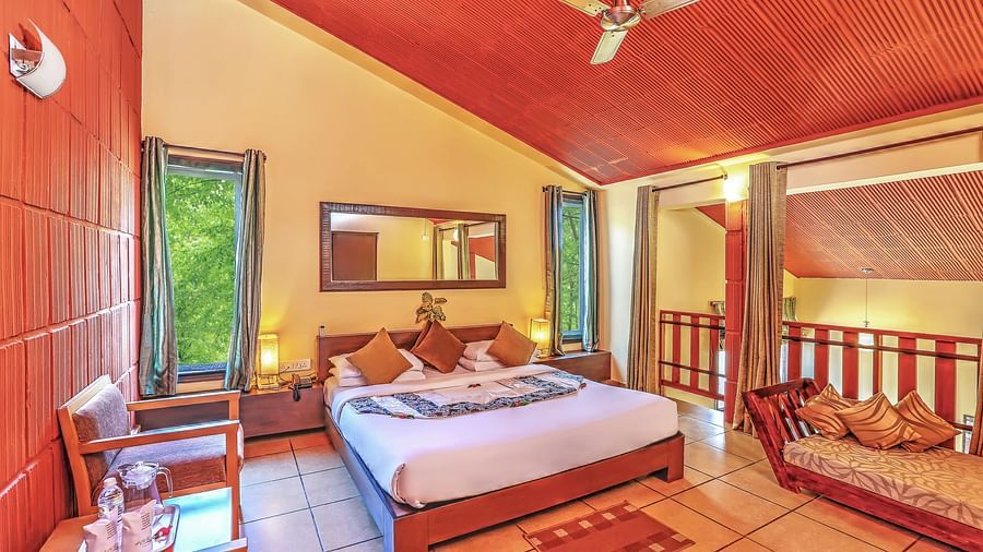 wide view of a bedroom with a large with with a ceiling fan and a workdesk and chair - Kadkani River Resort, Coorg