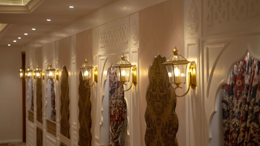 Elegant hallway with ornate wall decor and warm lighting - Kaldan Samudra Palace
