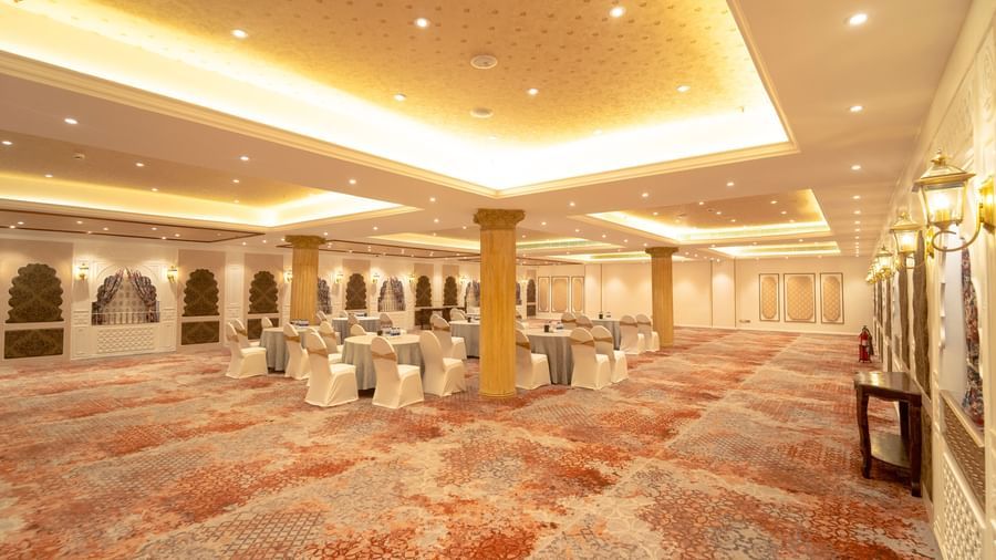Spacious banquet hall with warm golden lighting and arched designs - Kaldan Samudra Palace