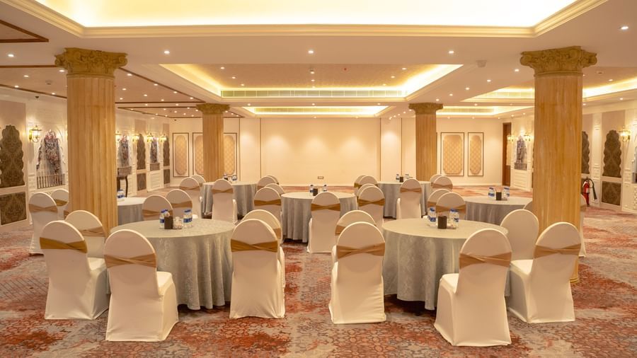 Lavish event space with round tables and grand columns - Kaldan Samudra Palace