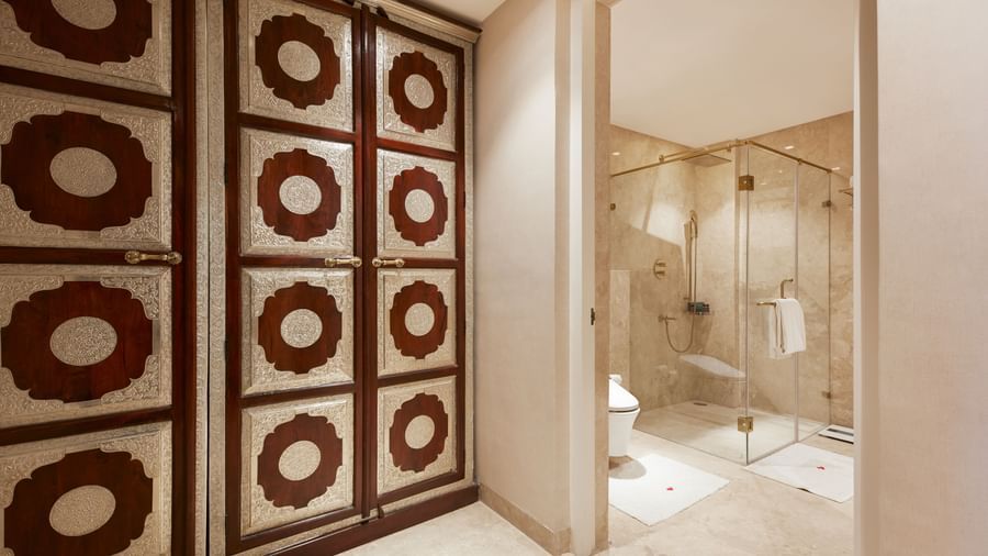 A hallway with intricate geometric decor and a luxurious vanity area - Kaldan Samudhra
