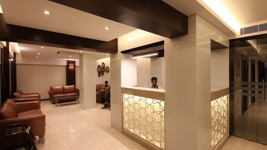 view of the lobby area with comfortable chairs and warm lights at Khanna Fiesta, Vellore